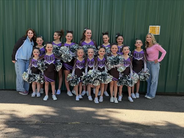 Young Nebo cheerleaders lined up with coaches